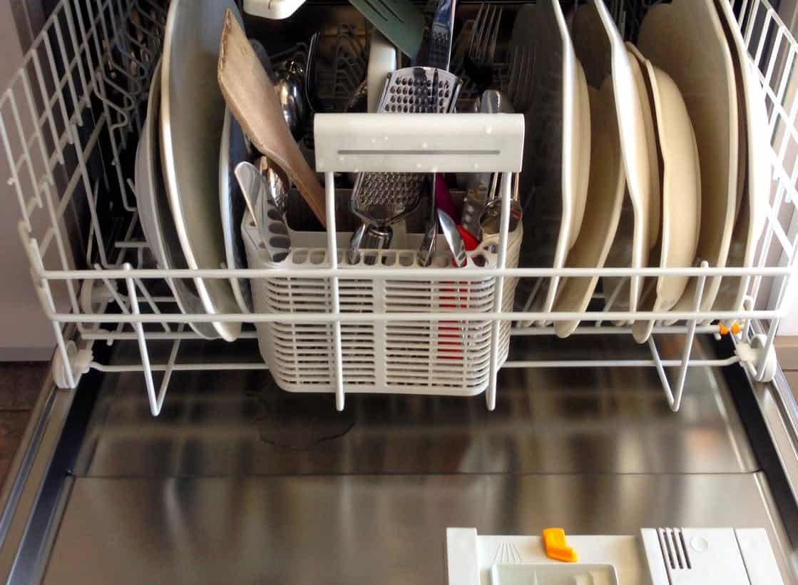 dishwasher full of dishes, spoon and fork, dishwasher that needs to be drain