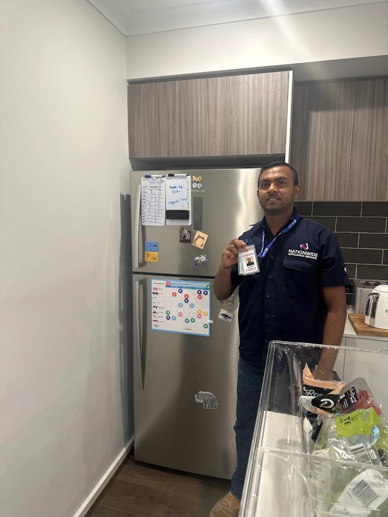 A technician done with Fridge Repairs