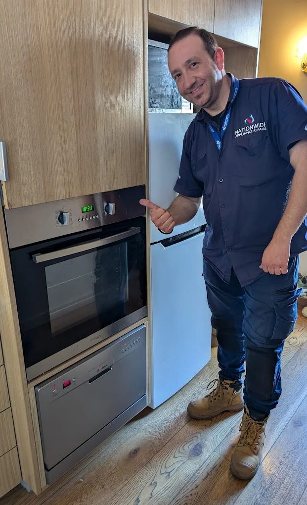 Jimmy fixing an oven appliance