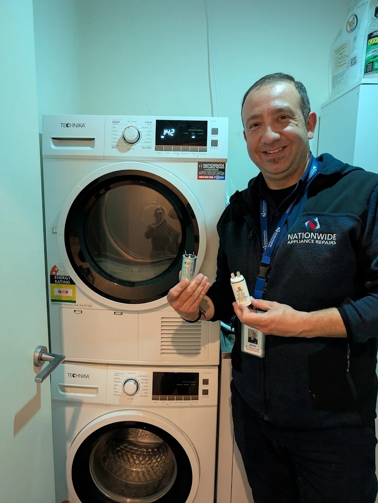 washing machine technician QAR Technician Jimmy with washing machine